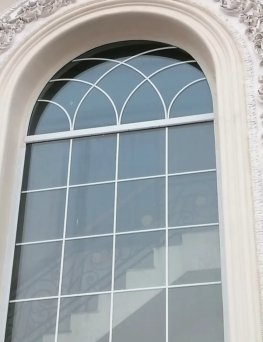 Arched window: White Georgian bars inside the glass
