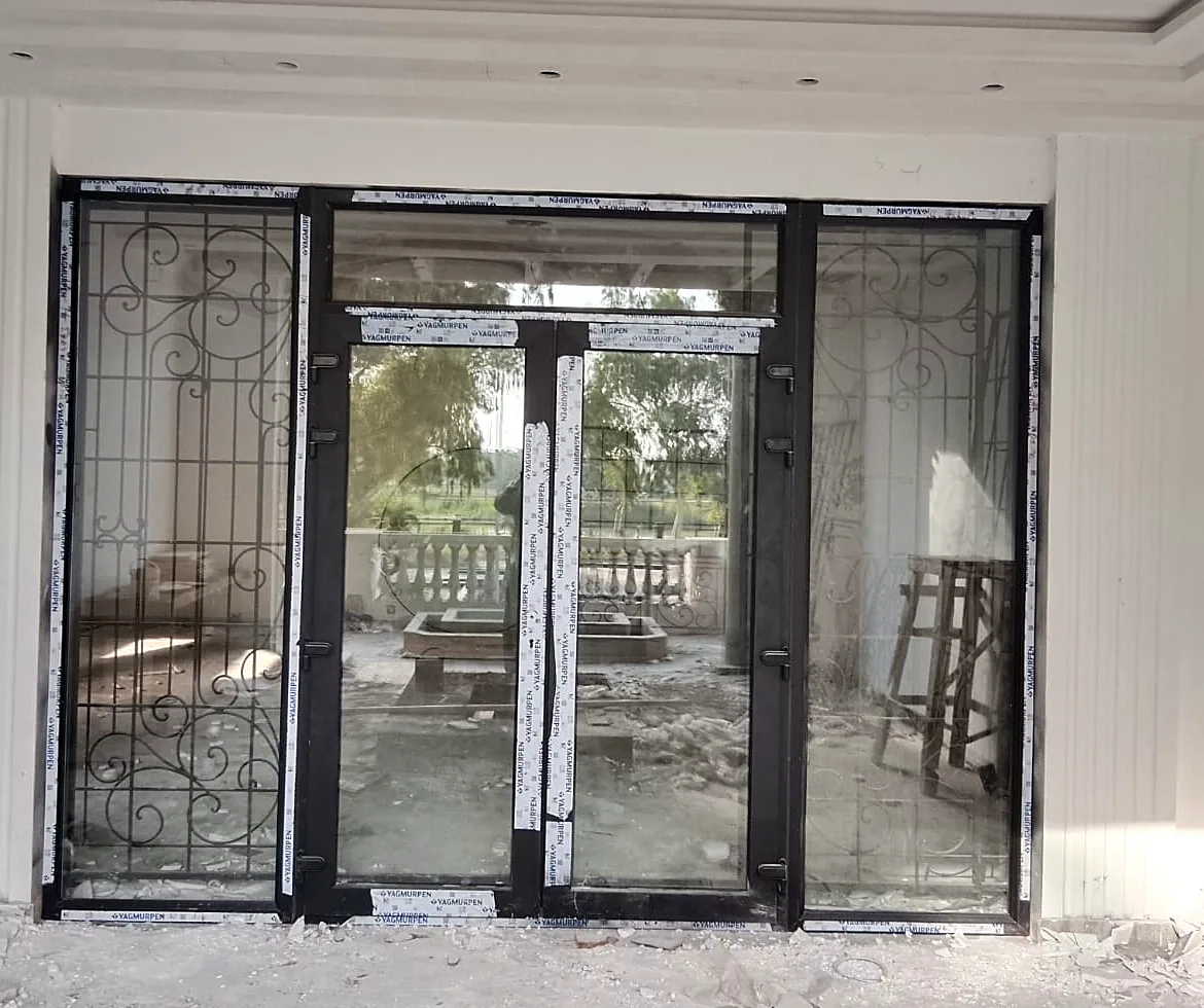 uPVC door and side lights: Black Yağmurpen profile, before the film comes off