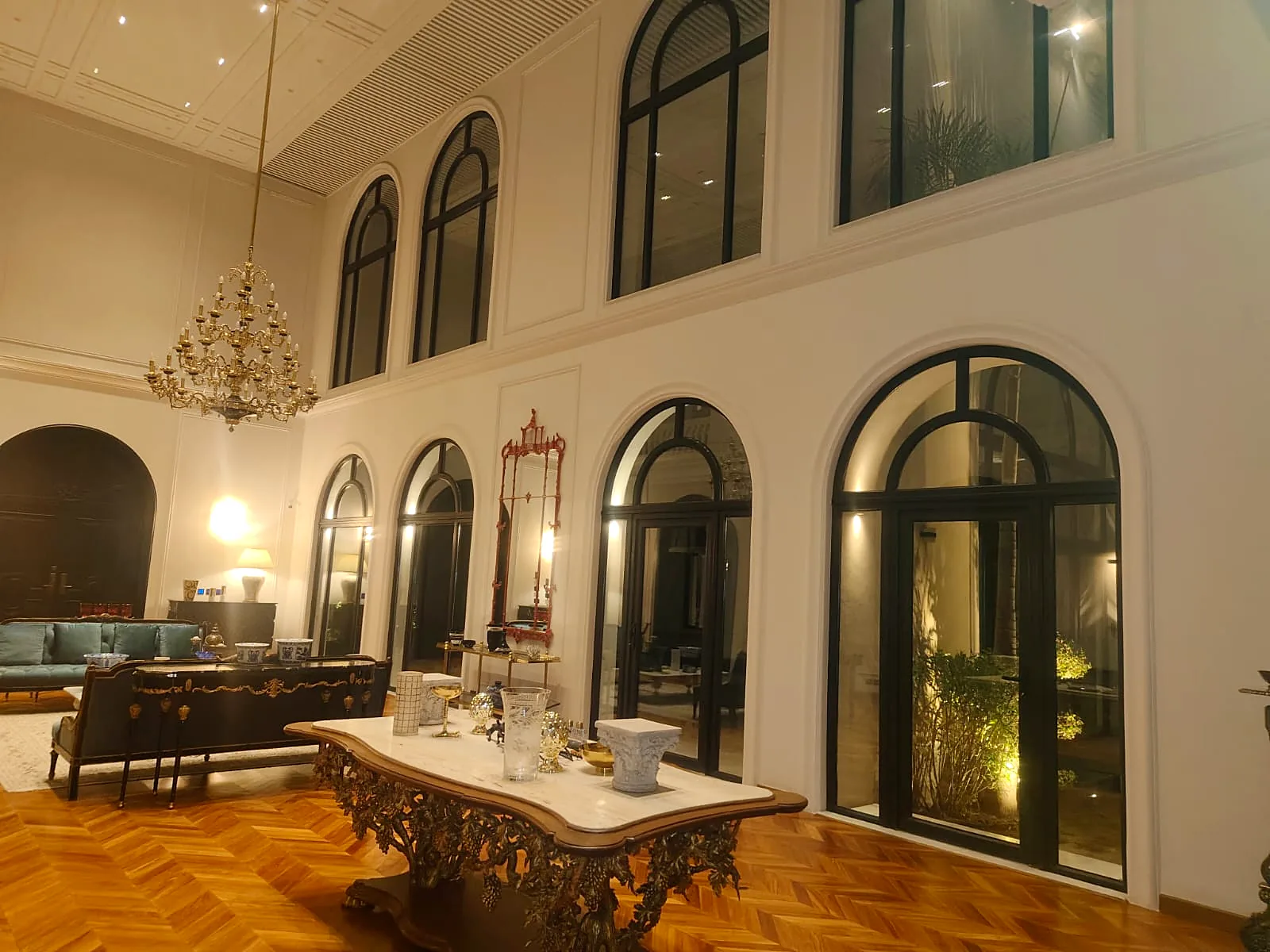 Formal lounge: Arched windows and doors in black uPVC