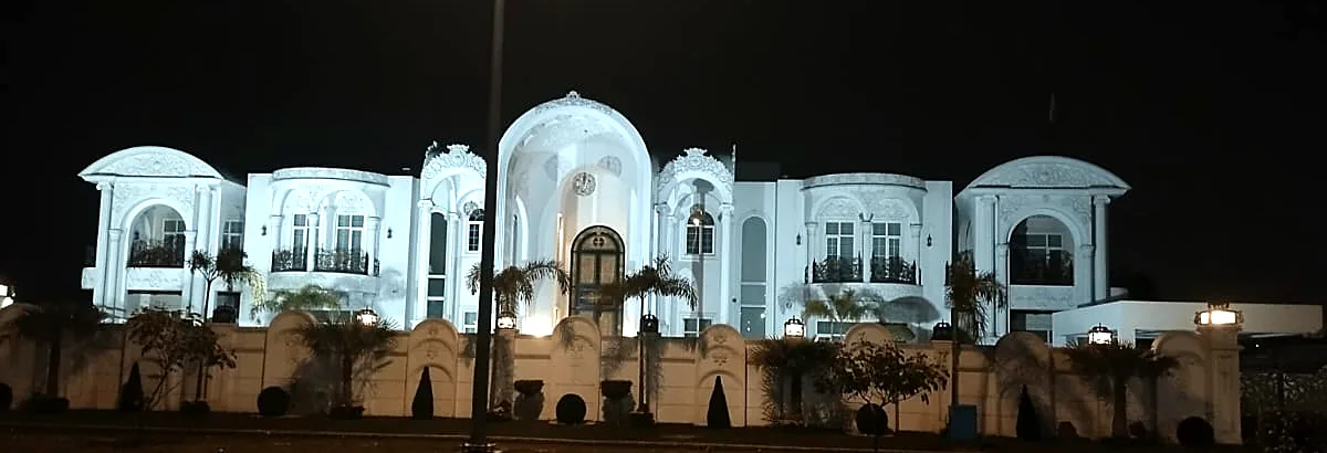 Palace residence at night: Arched windows and doors throughout